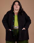 Sam is wearing Ripstop Field Coat in Basic Black