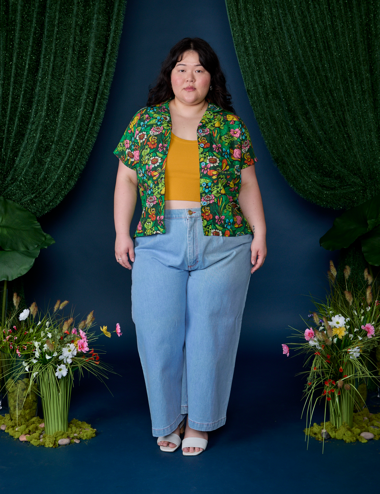 Ashley is wearing Pond Party Pantry Button-Up paired with light wash Indigo Wide Leg Trousers