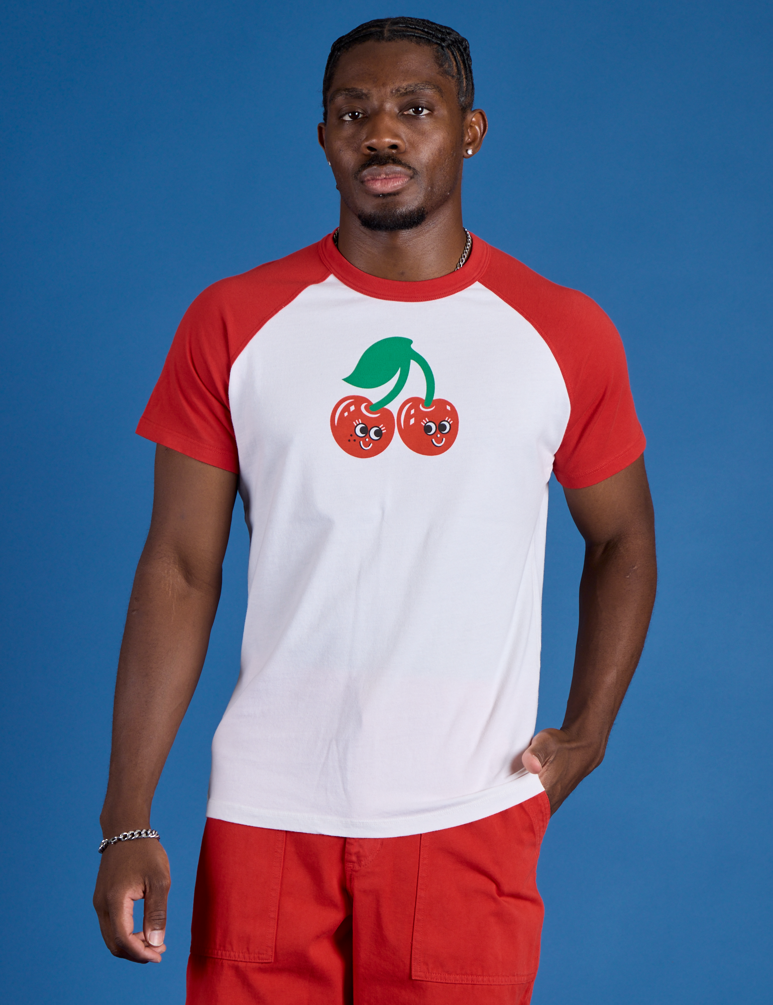 Issac is 5’10” and wearing M Produce Raglan Tee in Cherry
