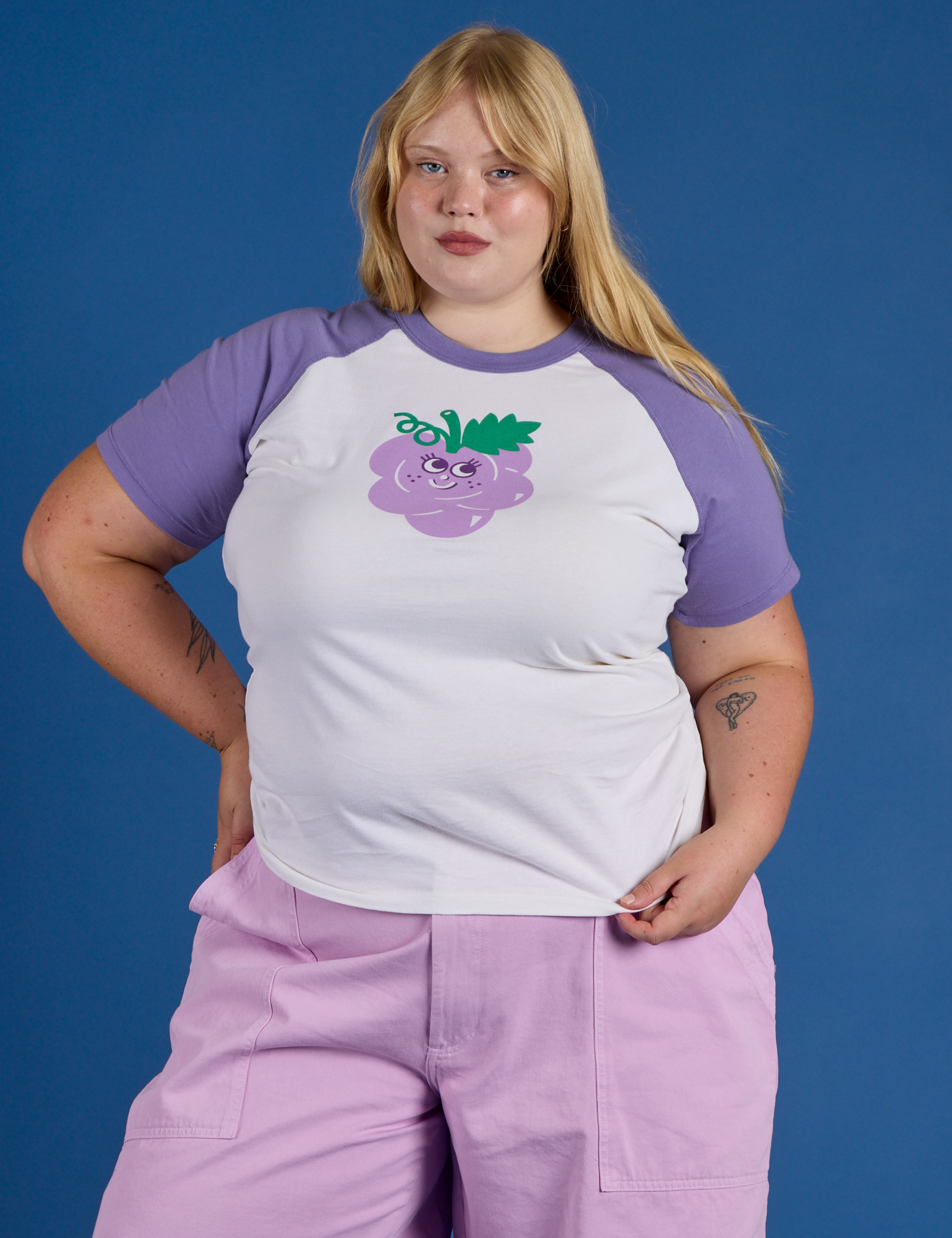 Juliet is 5’7” and wearing L Produce Raglan Tee in Grape