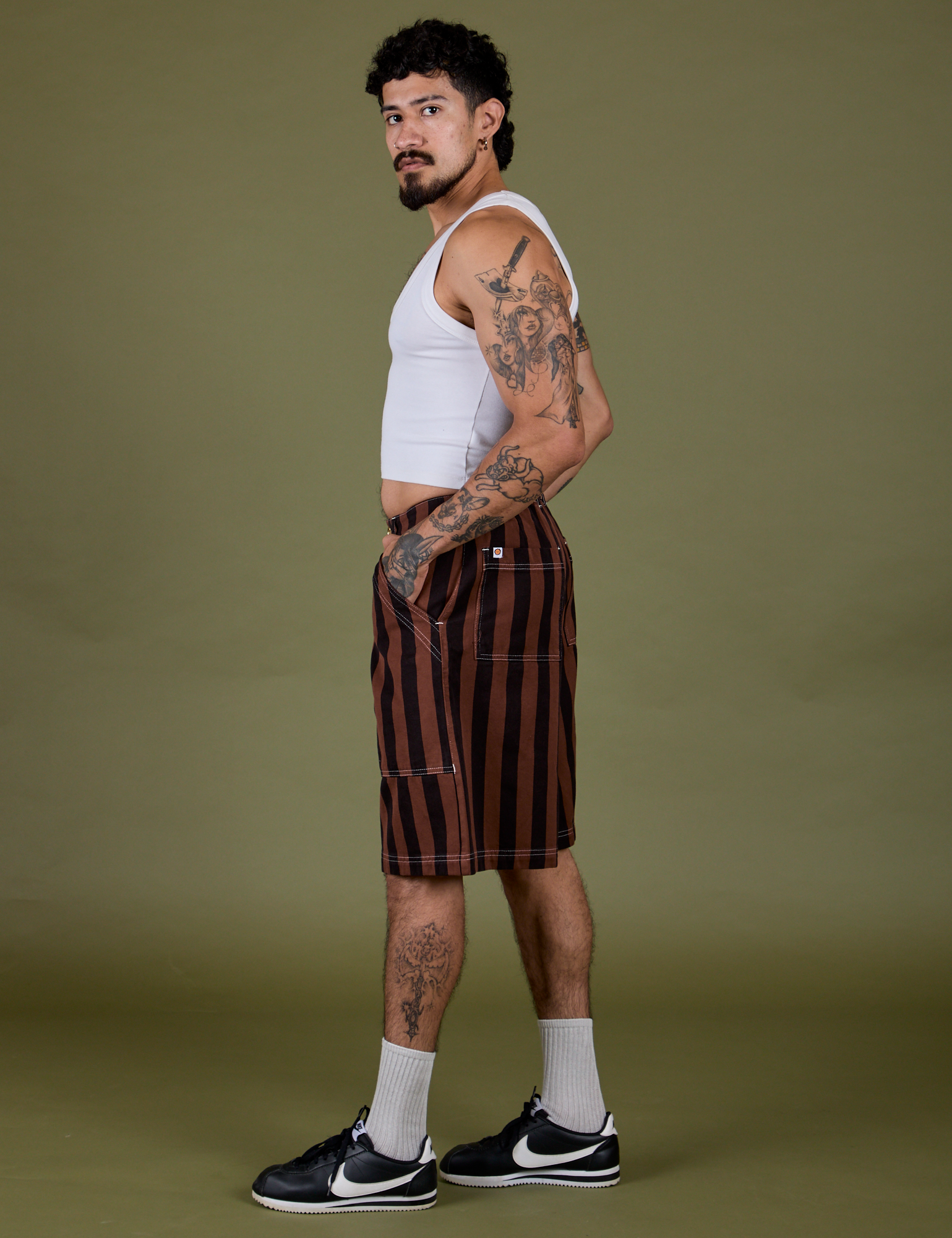 Side view of Longline Work Shorts in Fudgesicle Brown and vintage tee white Cropped Tank