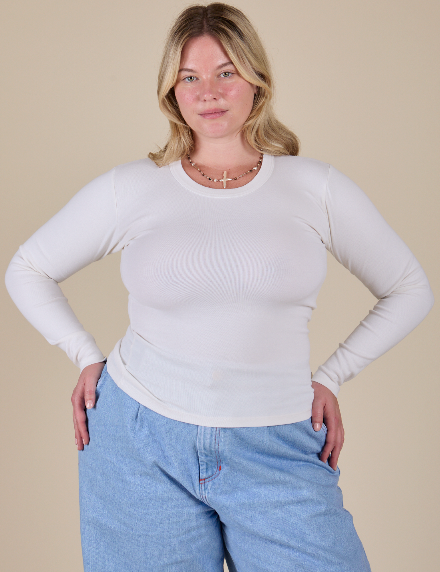 Lish is 5’8” and wearing XS Long Sleeve Baby Tee in Vintage Tee Off-White