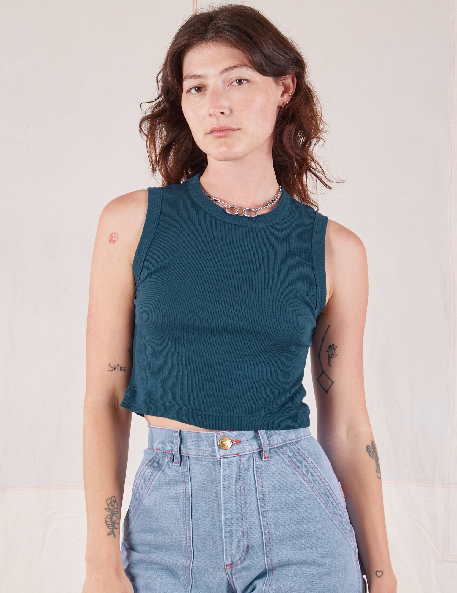 Alex is 5’8” and wearing P Muscle Tee in Lagoon