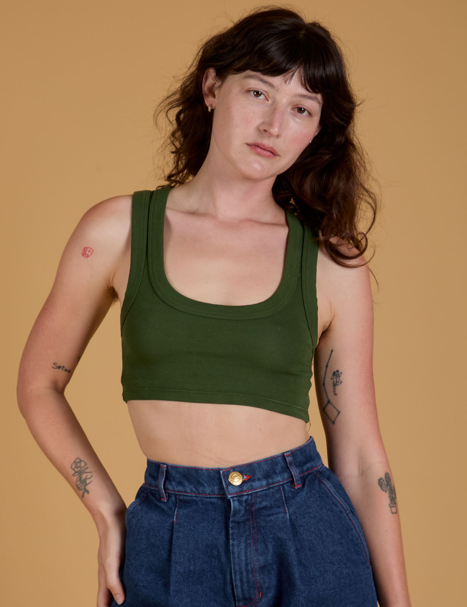 Alex is 5’8” and wearing P Mini Tank in Evergreen