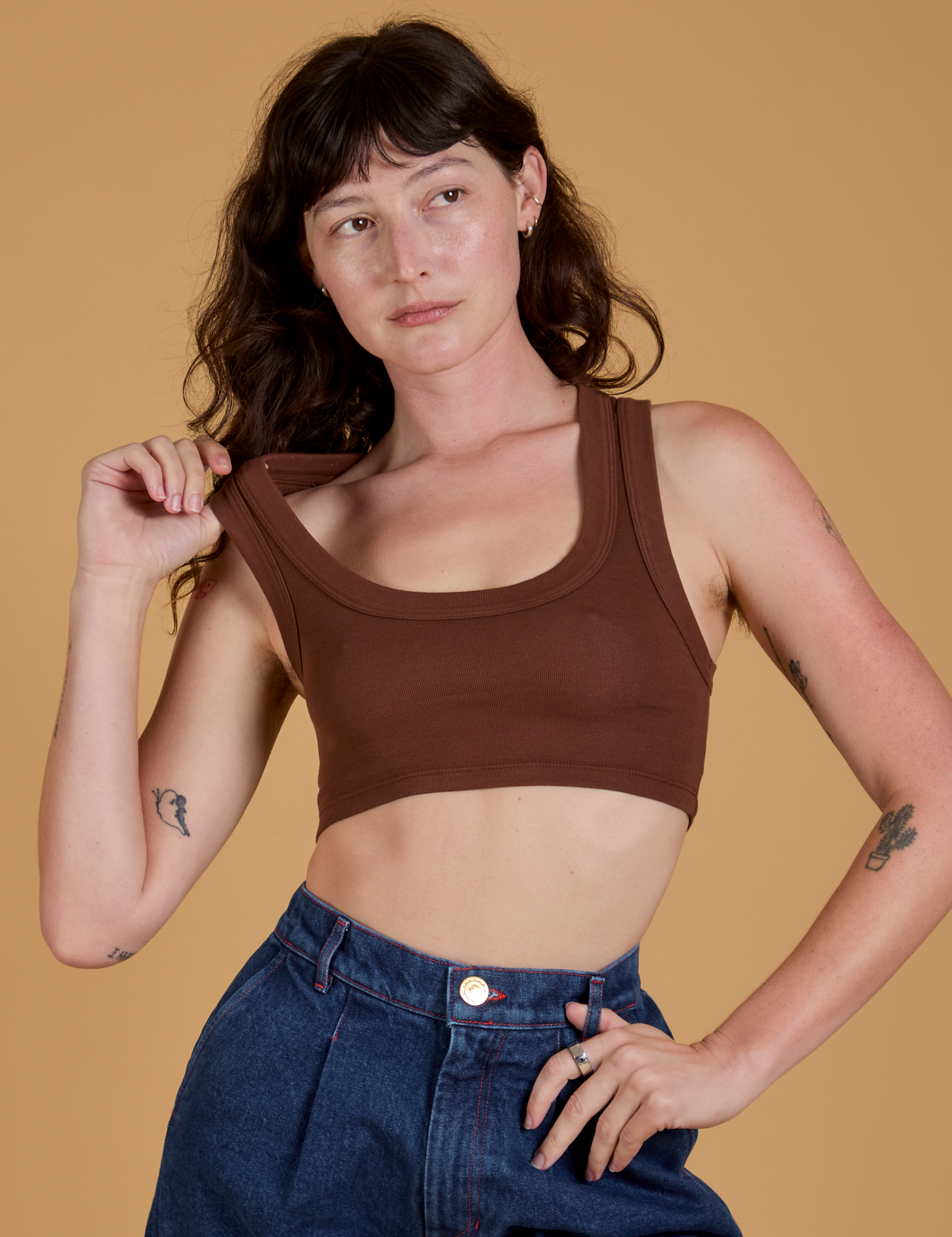 Alex is 5’8” and wearing P Mini Tank in Fudgesicle Brown