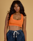 Kandia is 5’3” and wearing P Contrast Stitch Mini Tank in Construction Orange