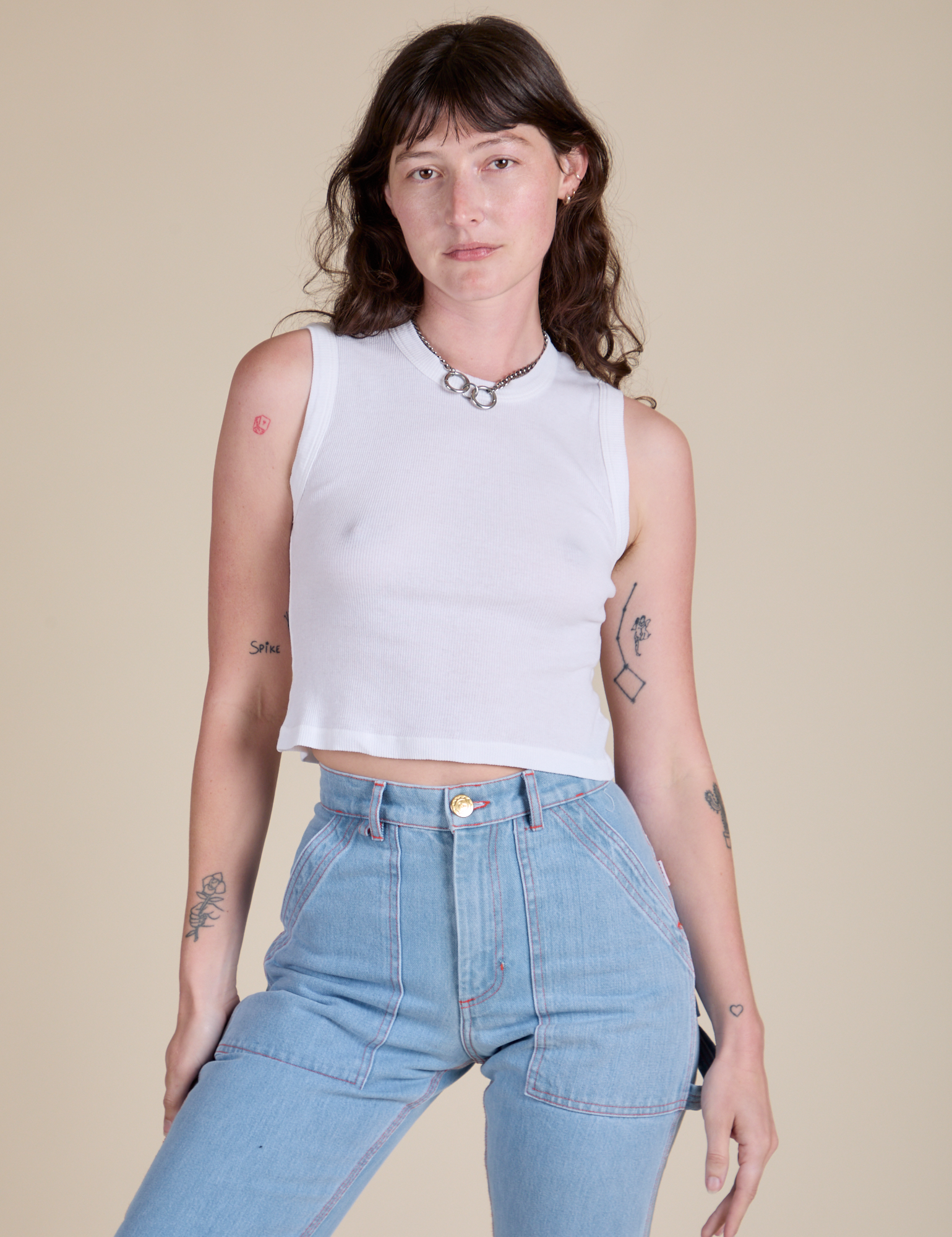 Alex is wearing Muscle Tee in Vintage Tee White