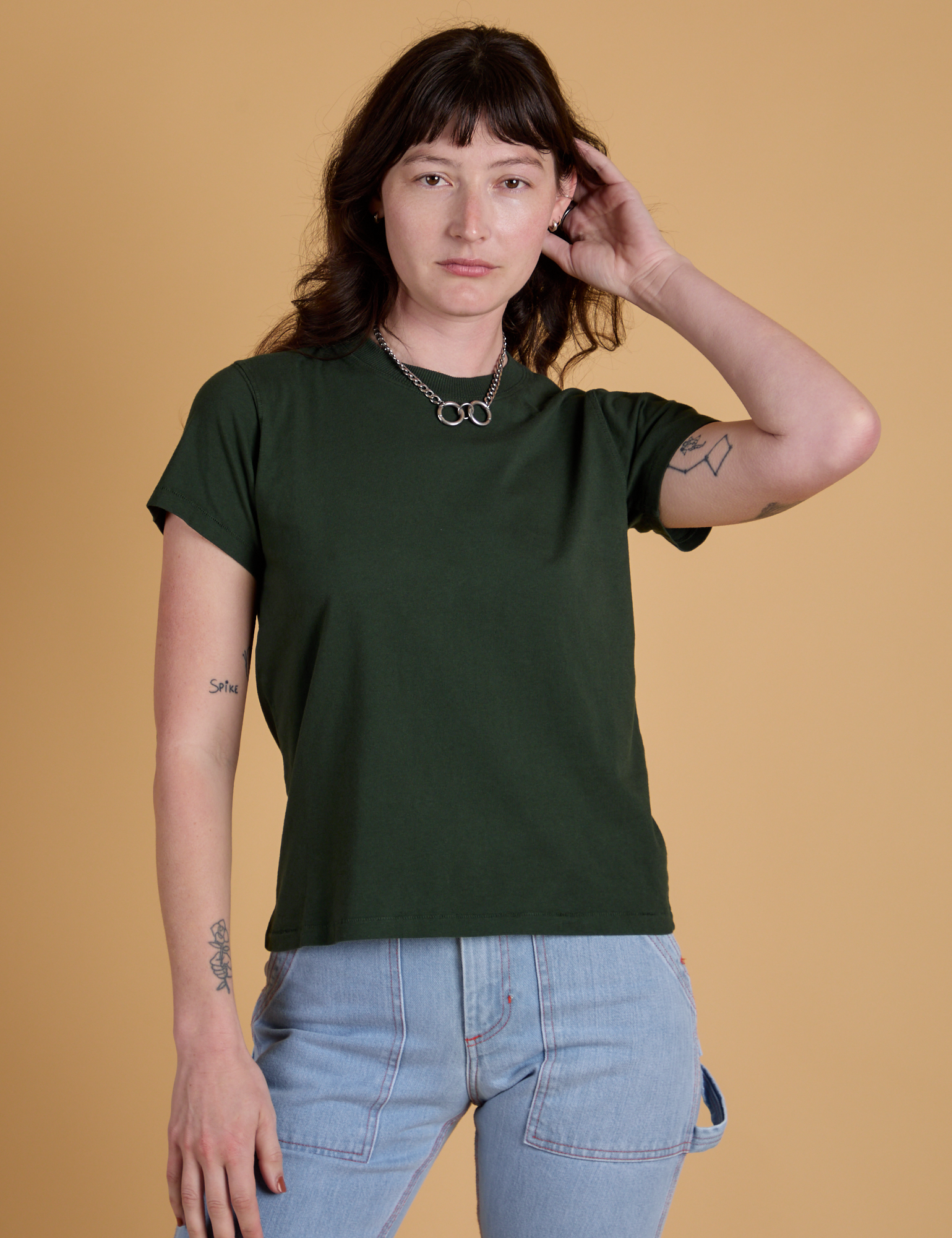 Alex is 5’8” and wearing P Organic Vintage Tee in Swamp Green