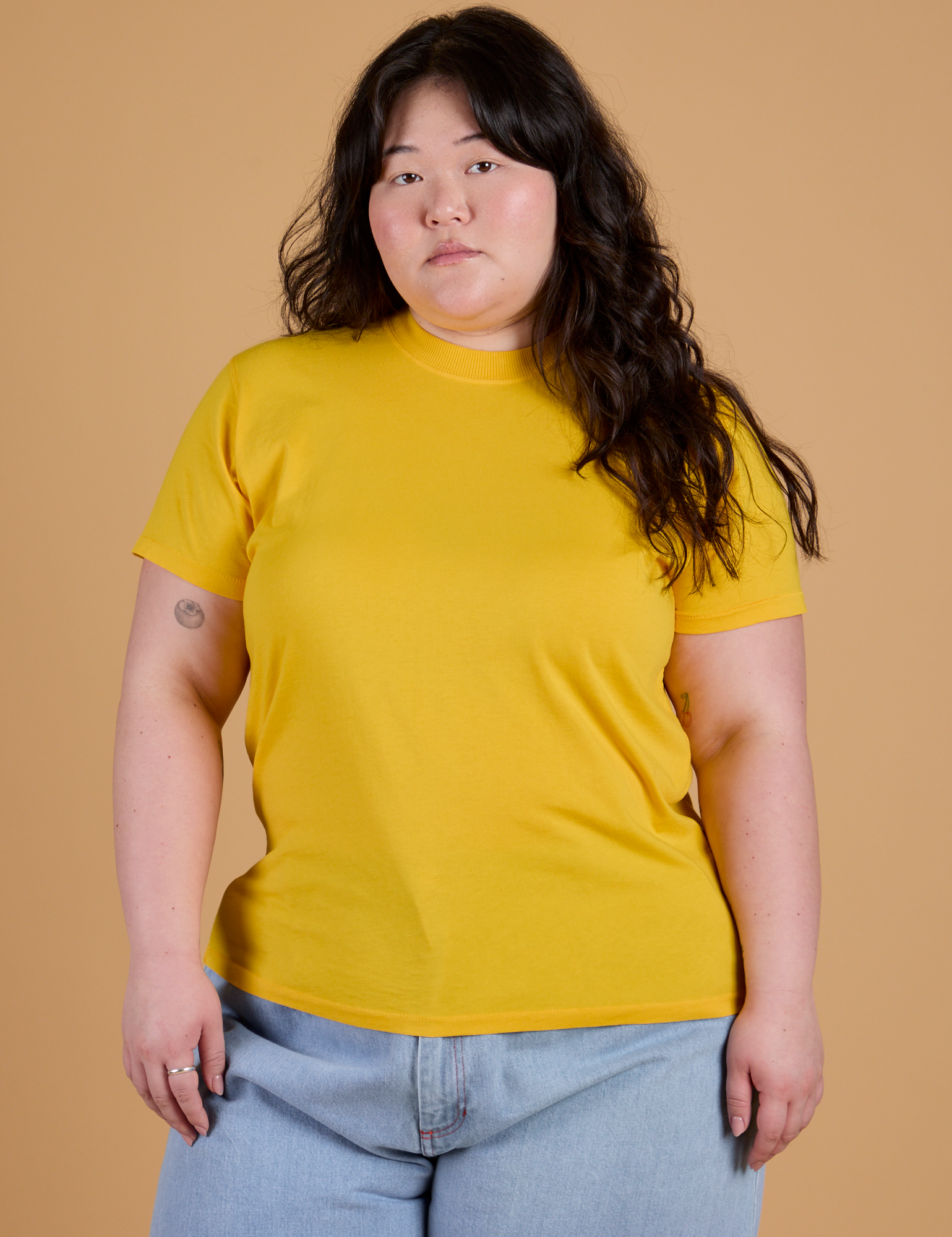 Ashley is 5’7” and wearing L Organic Vintage Tee in Sunshine Yellow