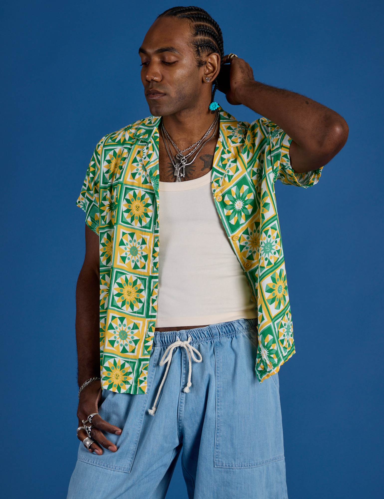 Jerrod is wearing Spring Quilt Print Pantry Button-Up with light wash Denim Drop Pocket Pants