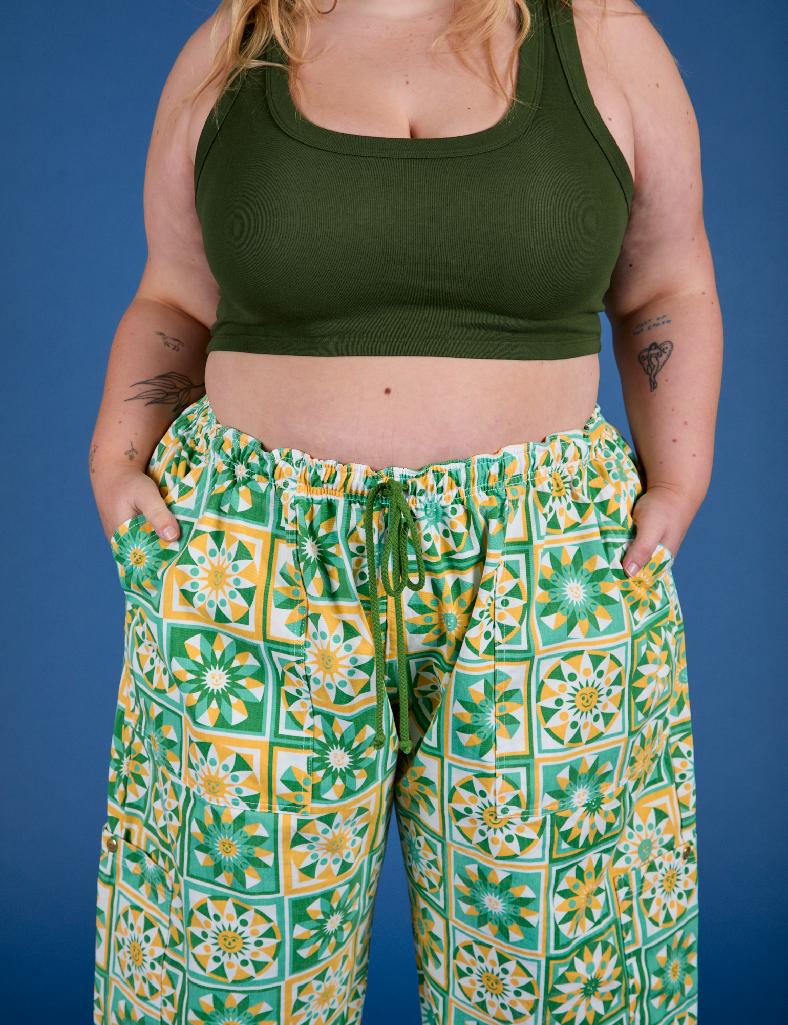 Close up of Drop Pocket Cargo Pants in Spring Quilt Print and evergreen Mini Tank