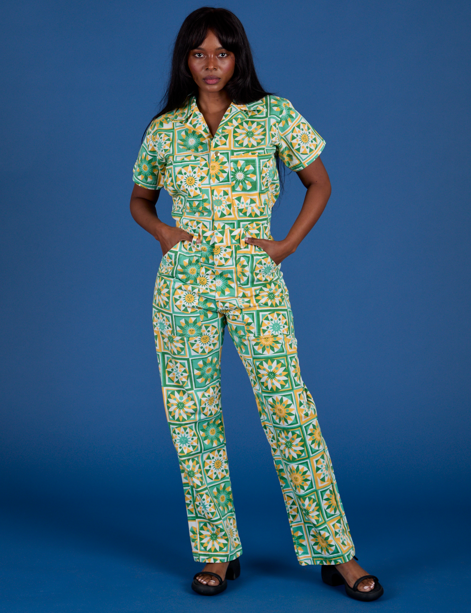 Kandia is 5’3” and wearing XS Spring Quilt Print Jumpsuit