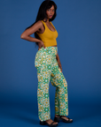 Side view of Work Pants in Spring Quilt Print and Cropped tank in Mustard Yellow on Kandia