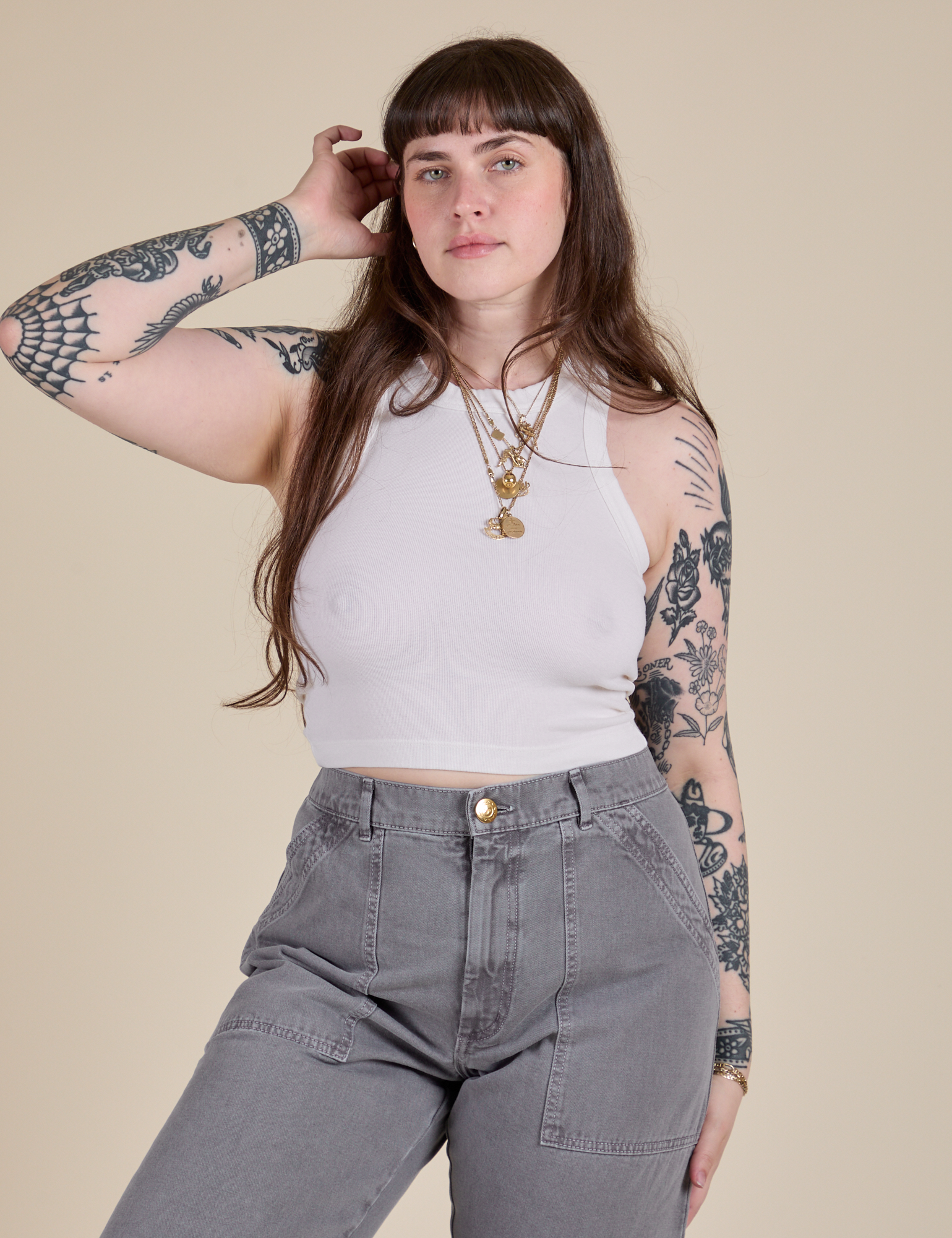 Sydney is 5’9” and wearing XXS Racerback Tank in Vintage Tee White