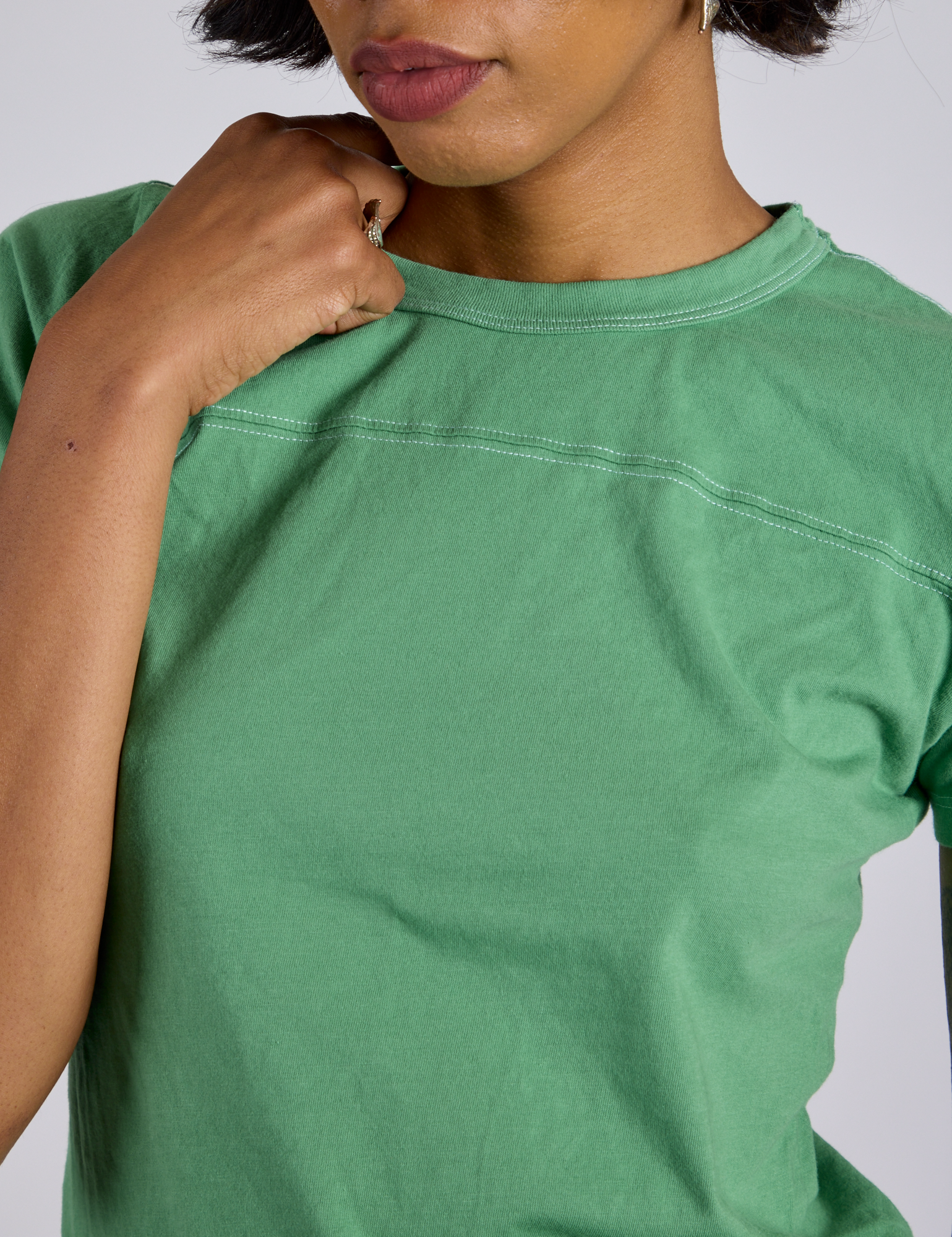 Close up of Jr. Varsity Tee in Seafoam Green on Kira