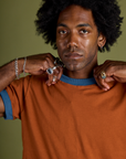 Front close up of Vintage Ringer Tee in Burnt Terracotta on Jerrod