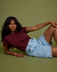 Vintage Ringer Tee in Red Wine and light wash Carpenter Shorts on Kandia