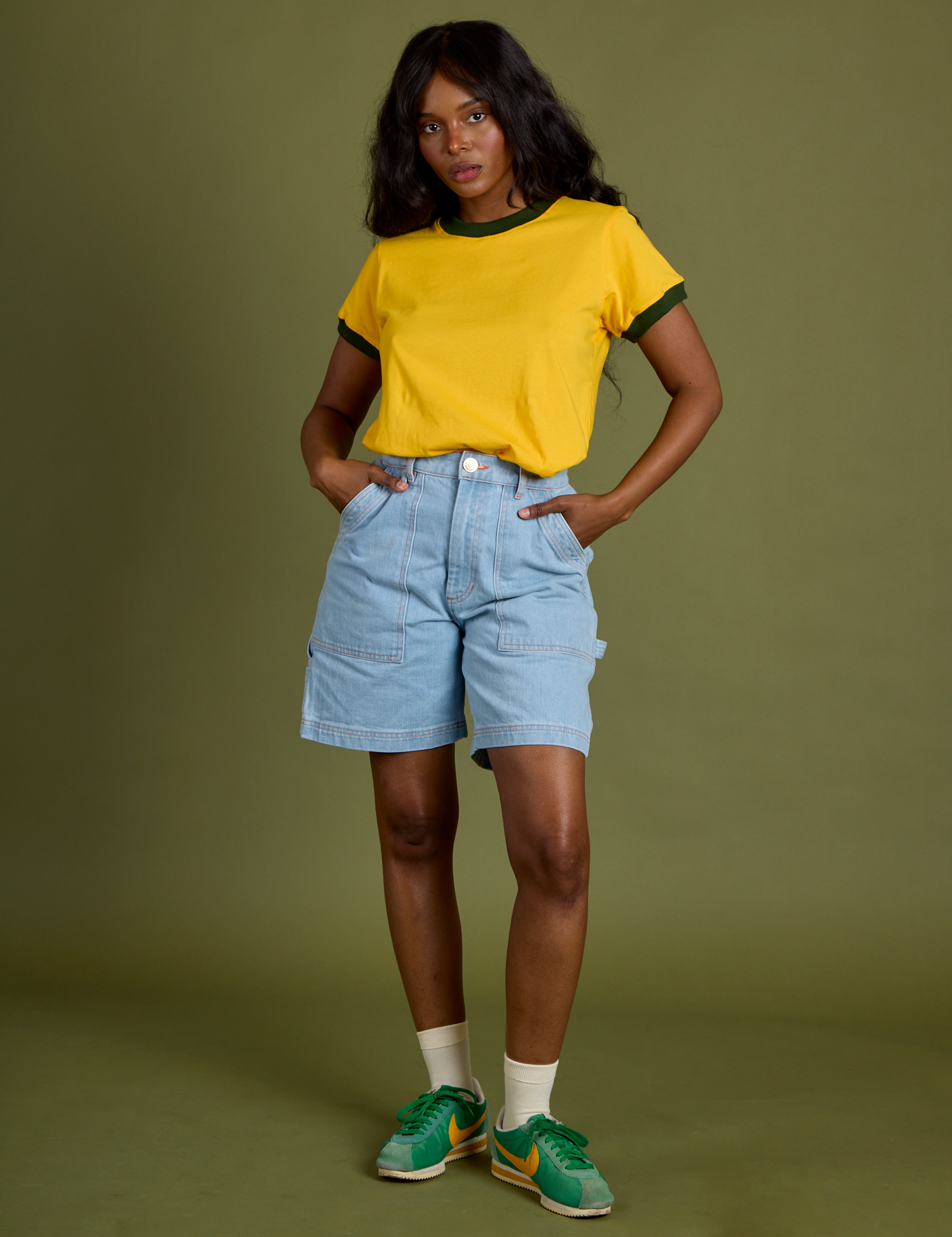 Kandia is wearing Vintage Ringer Tee in Sunshine Yellow and light wash Carpenter Shorts