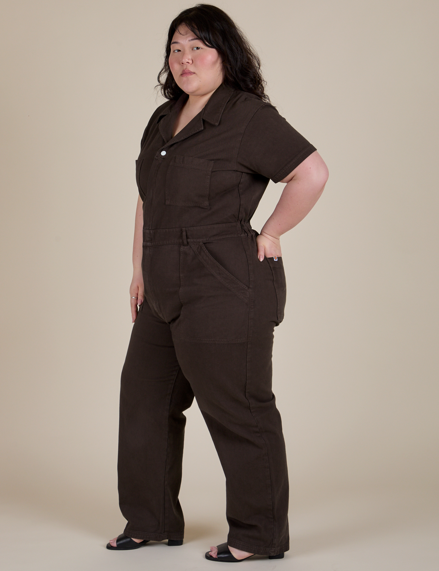 Angled front view of Short Sleeve Jumpsuit in Espresso Brown on Ashley