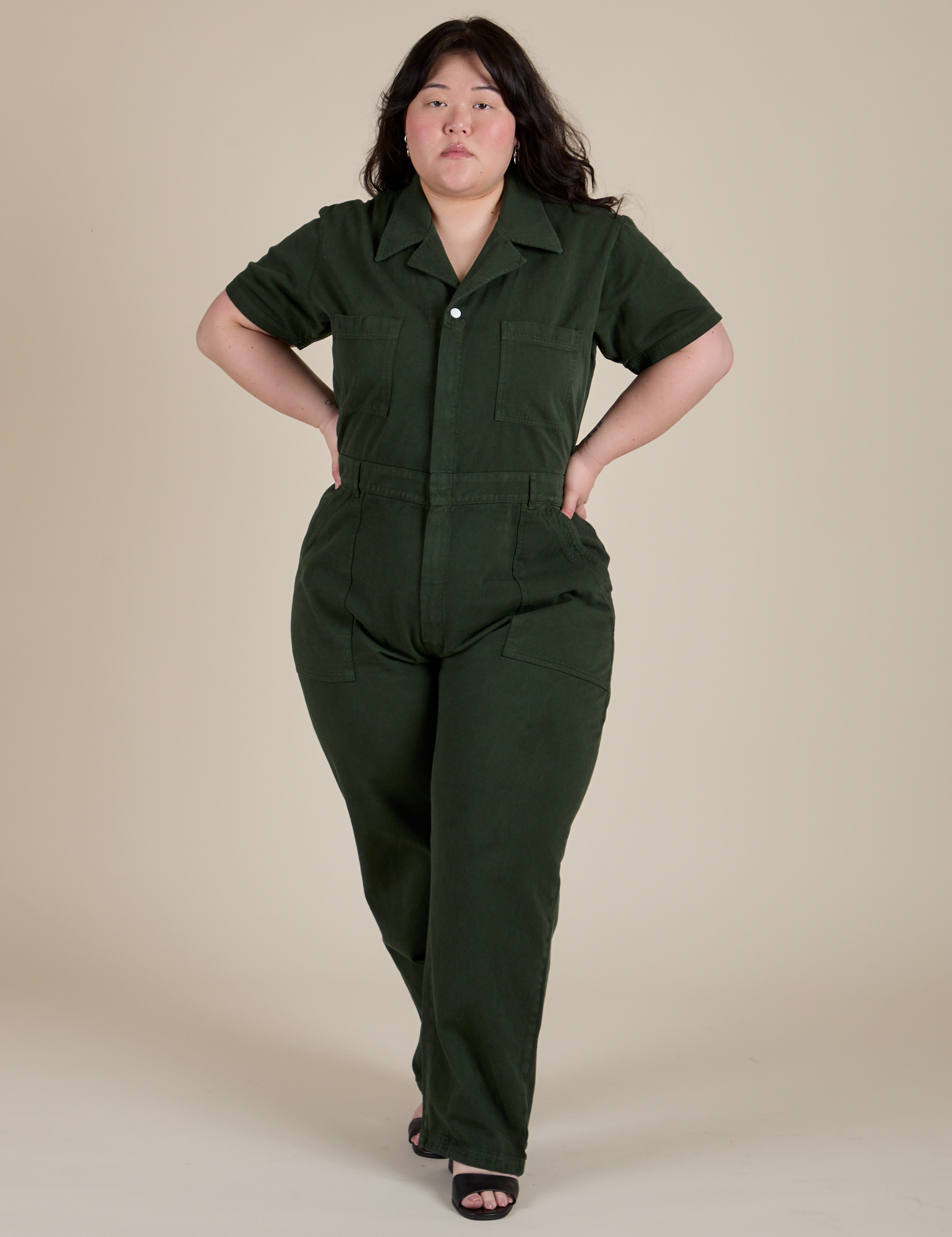 Ashley is wearing Short Sleeve Jumpsuit in Swamp Green