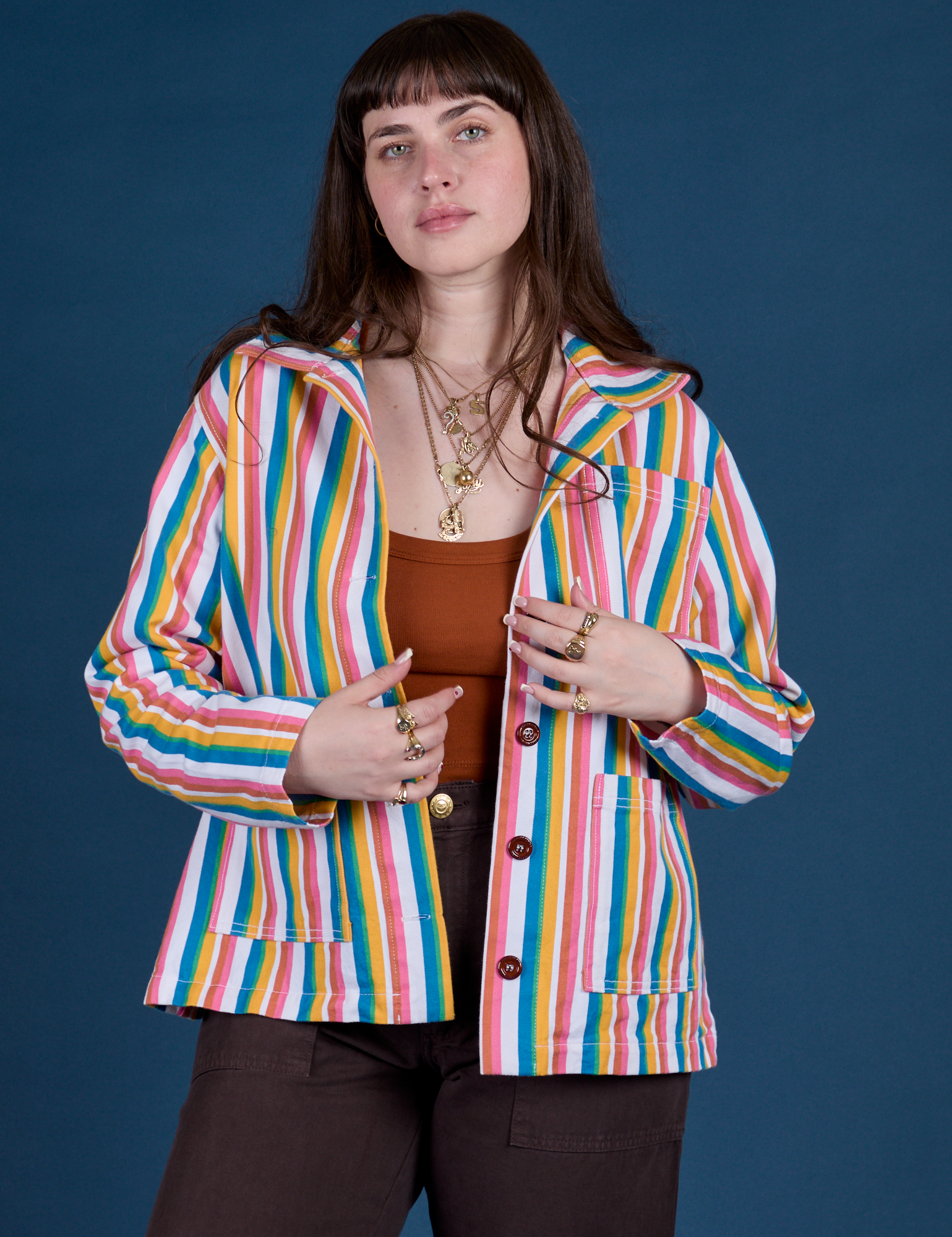 Sydney is wearing Stripe Work Jacket in Rainbow Stripe