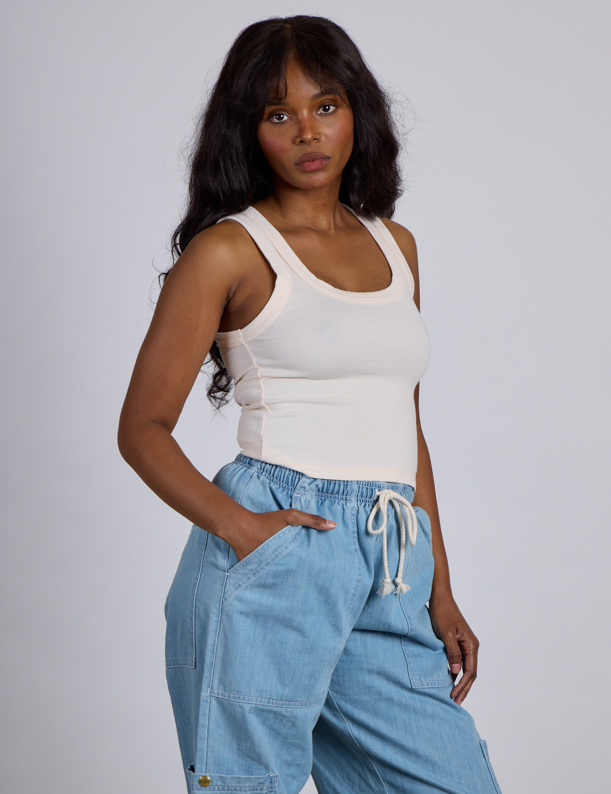 Angled front view of  The Tank Top in Vintage Tee Off-White on Kandia
