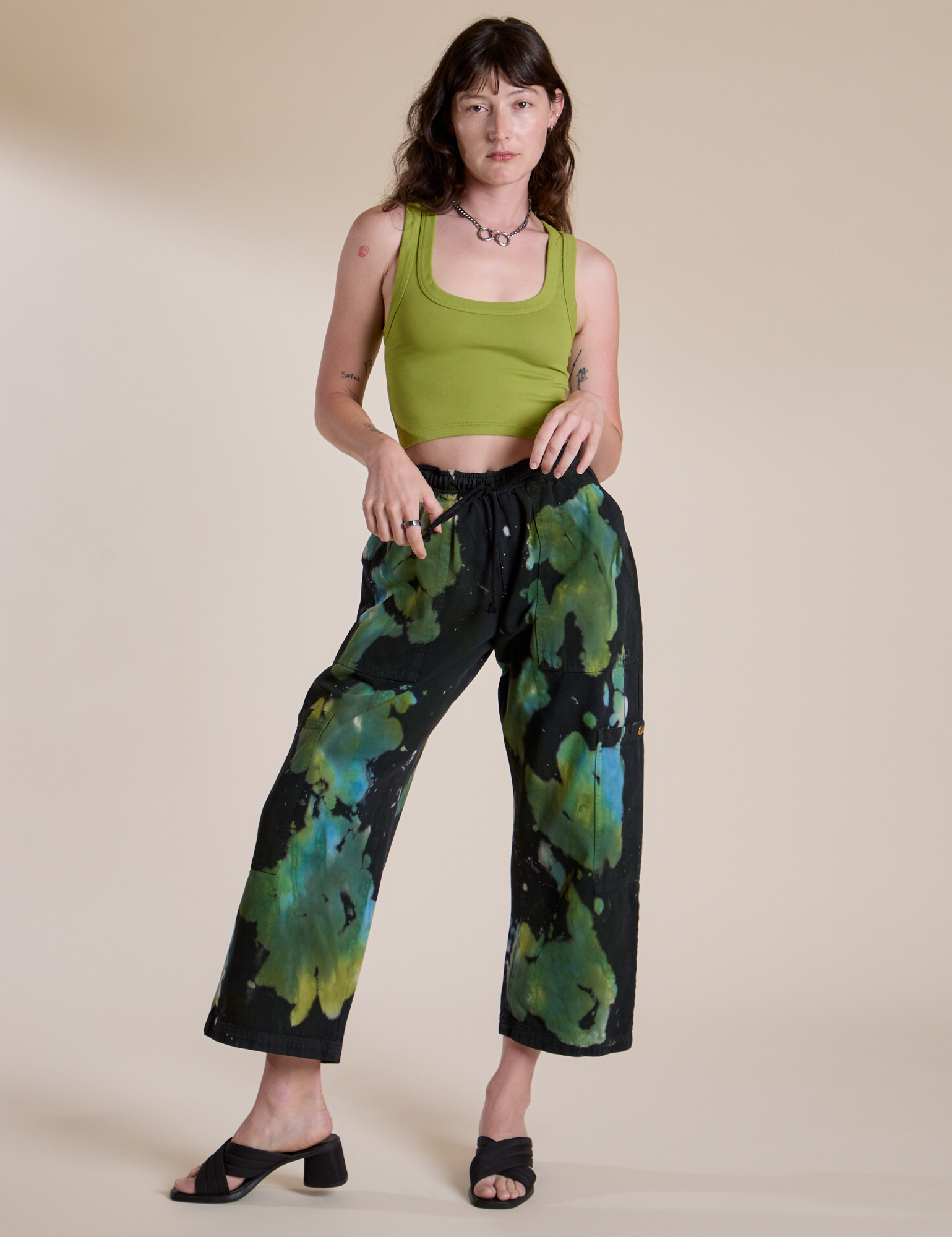 Alex is wearing Magic Waters Drop Pocket Pants in Green Pool and gross green Cropped Tank Top