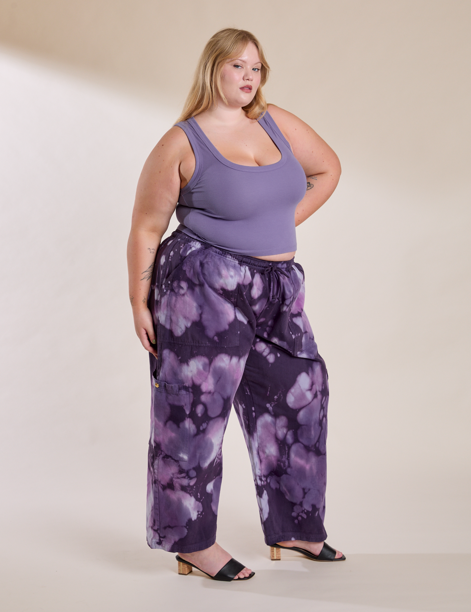 Angled front view of Magic Waters Drop Pocket Pants in Dark Lavender and faded grape Cropped Tank on Juliet