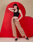 Alex is wearing  Hot Stuff Drop Pocket Cargo Pants and black Cropped Tank