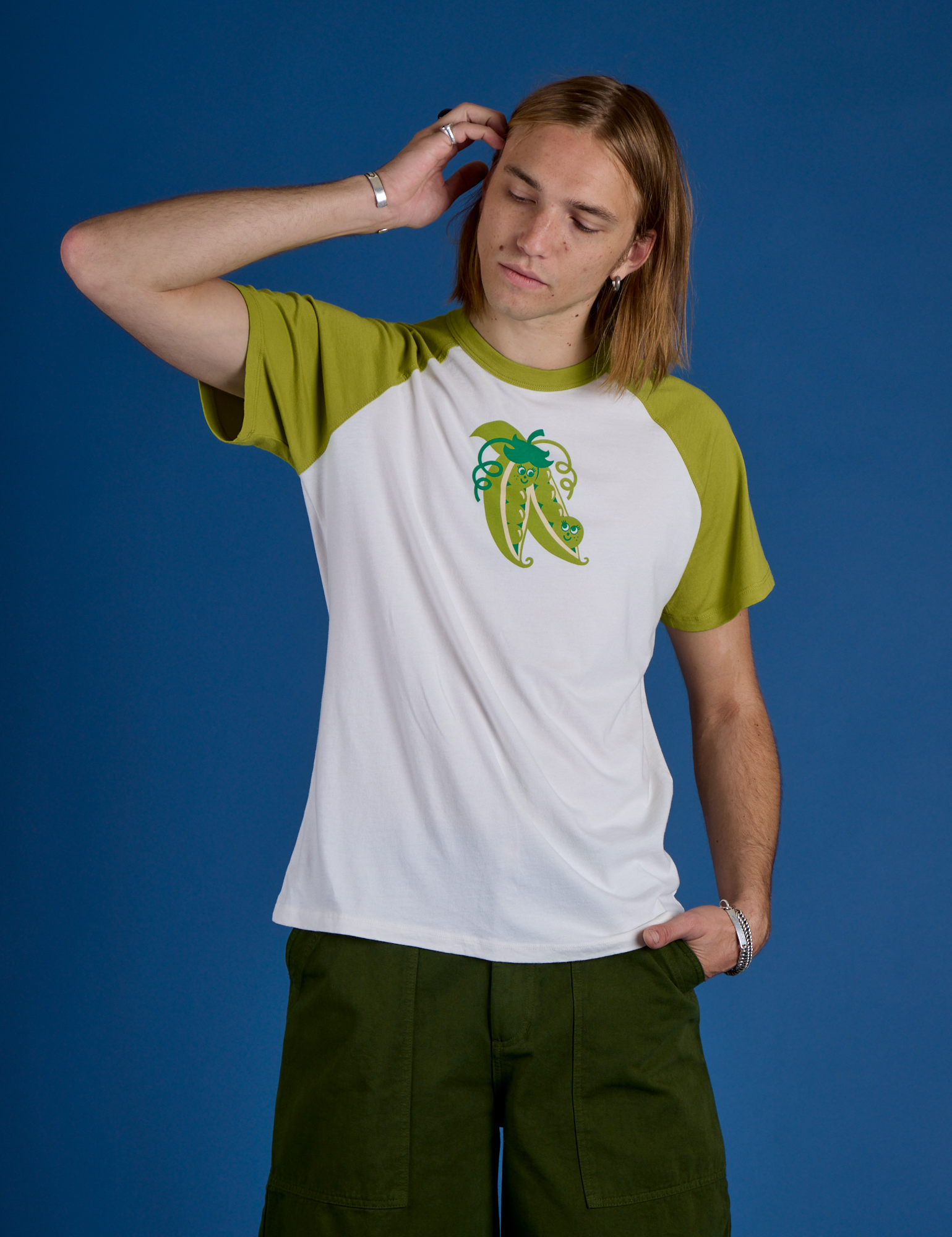 Grant is 6’5” and wearing L Produce Raglan Tee in Snap Peas