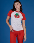 Alex is 5’8” and wearing P Produce Raglan Tee in Tomato
