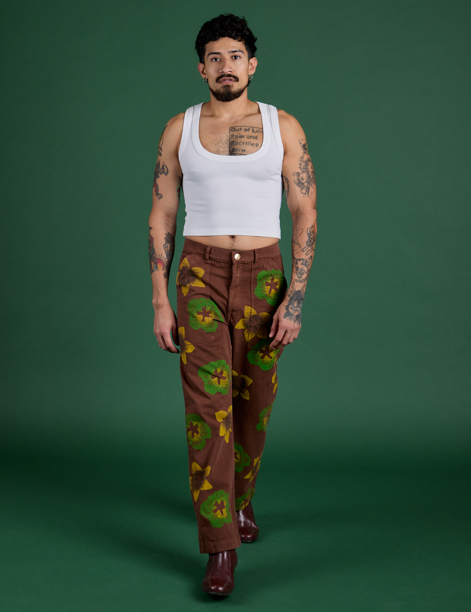 Jesse is wearing Floral Painted Work Pants in Brown and Cropped Tank in Vintage Tee White