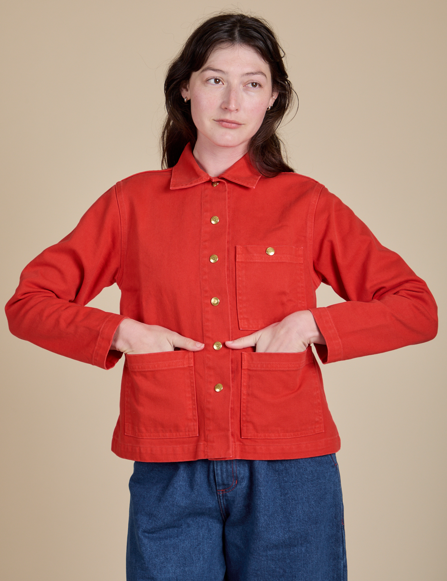 Alex is 5'8" and wearing P Denim Work Jacket in Mustang Red