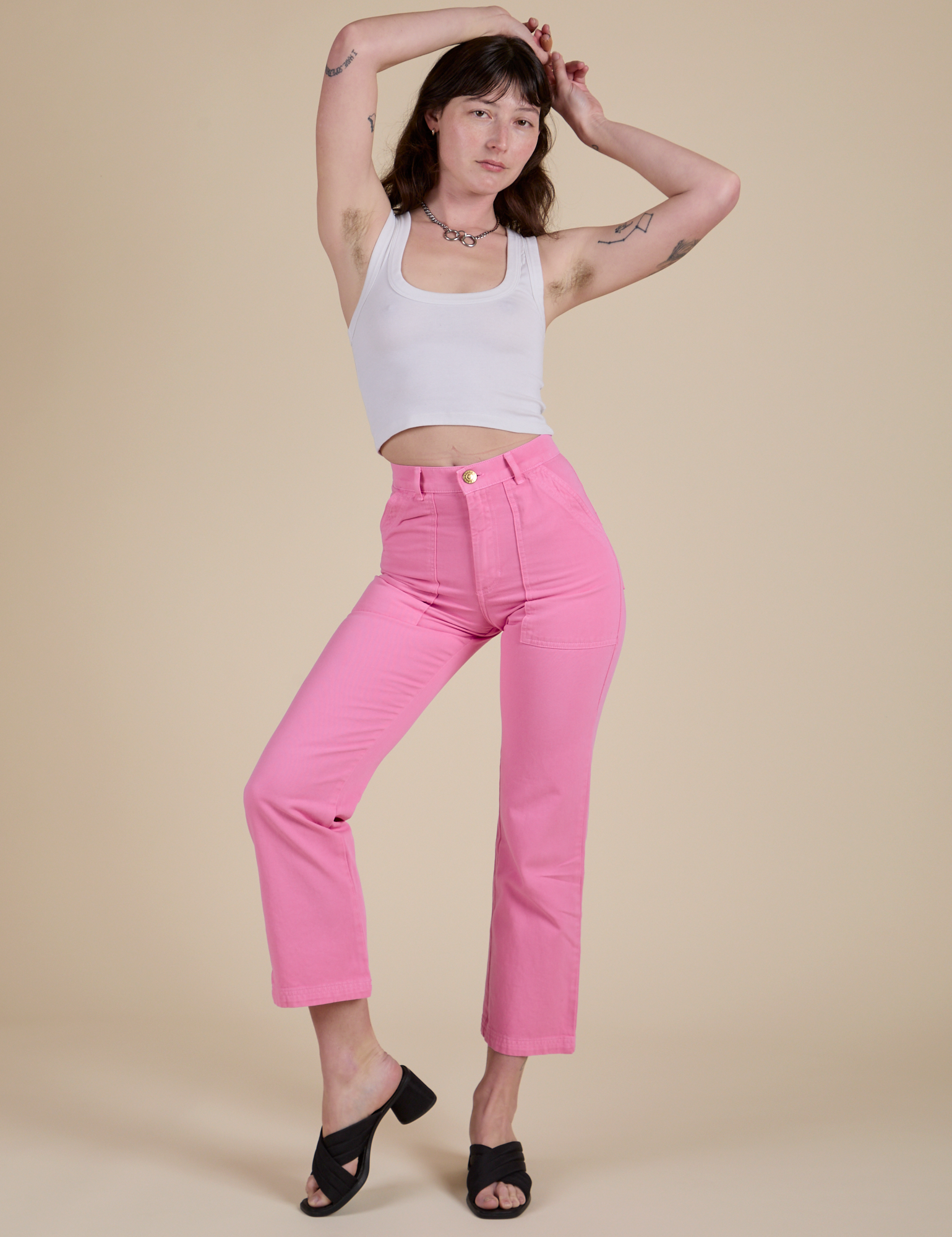 Alex is wearing Work Pants in Bubblegum Pink and vintage tee white Cropped Tank