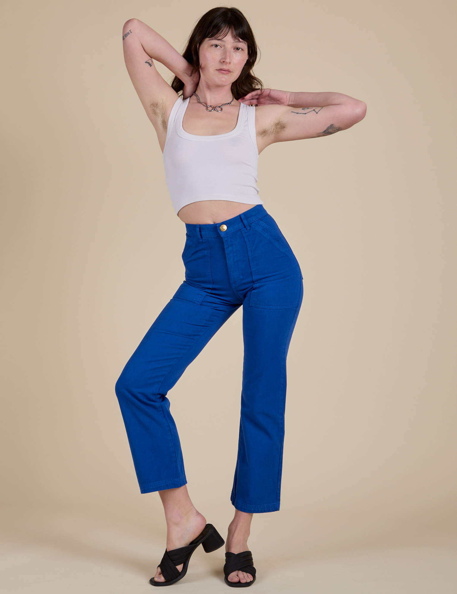 Alex is wearing Work Pants in Royal Blue and vintage tee white Cropped Tank