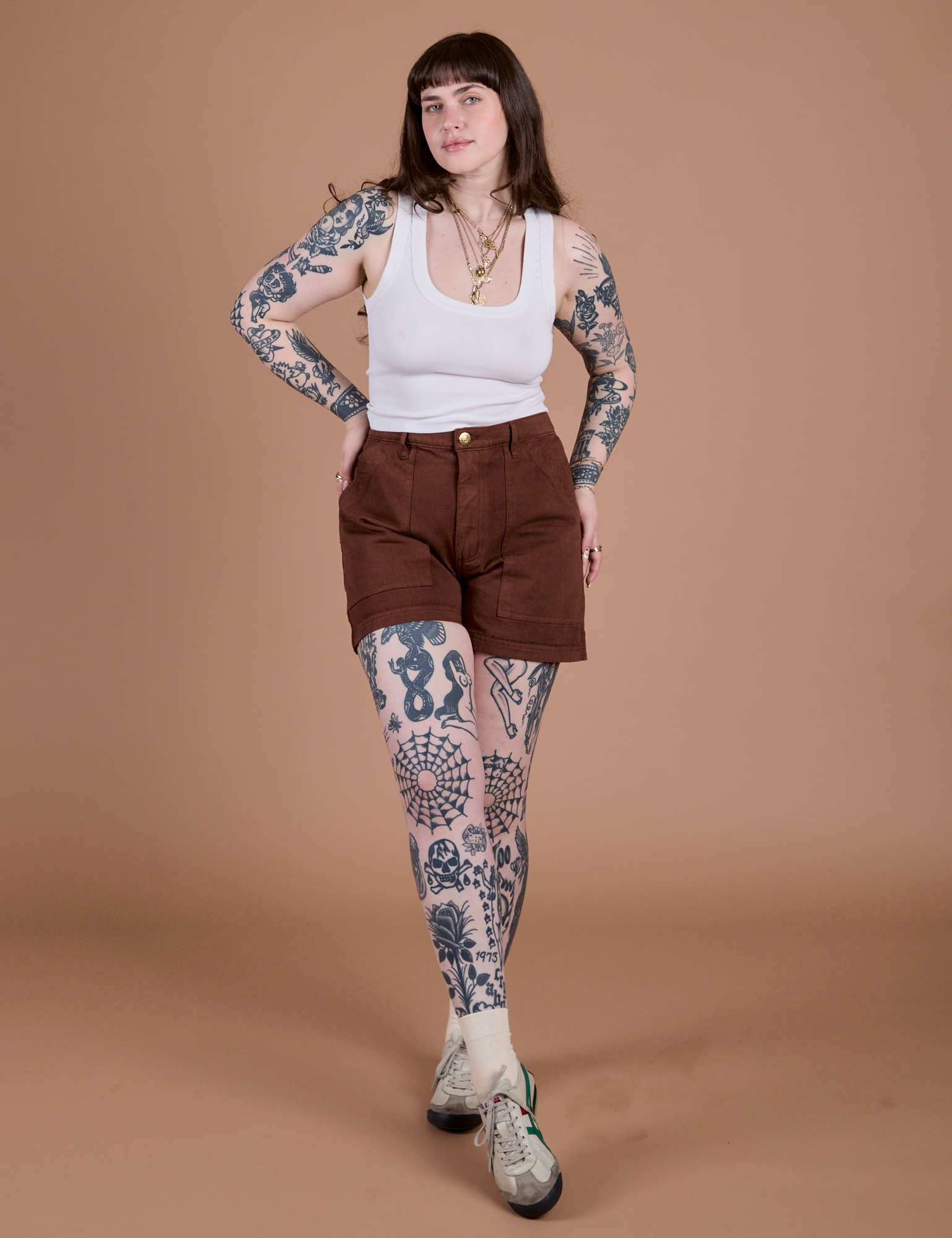 Sydney is wearing Classic Work Shorts in Fudgesicle Brown and a Cropped Tank in Vintage Tee White