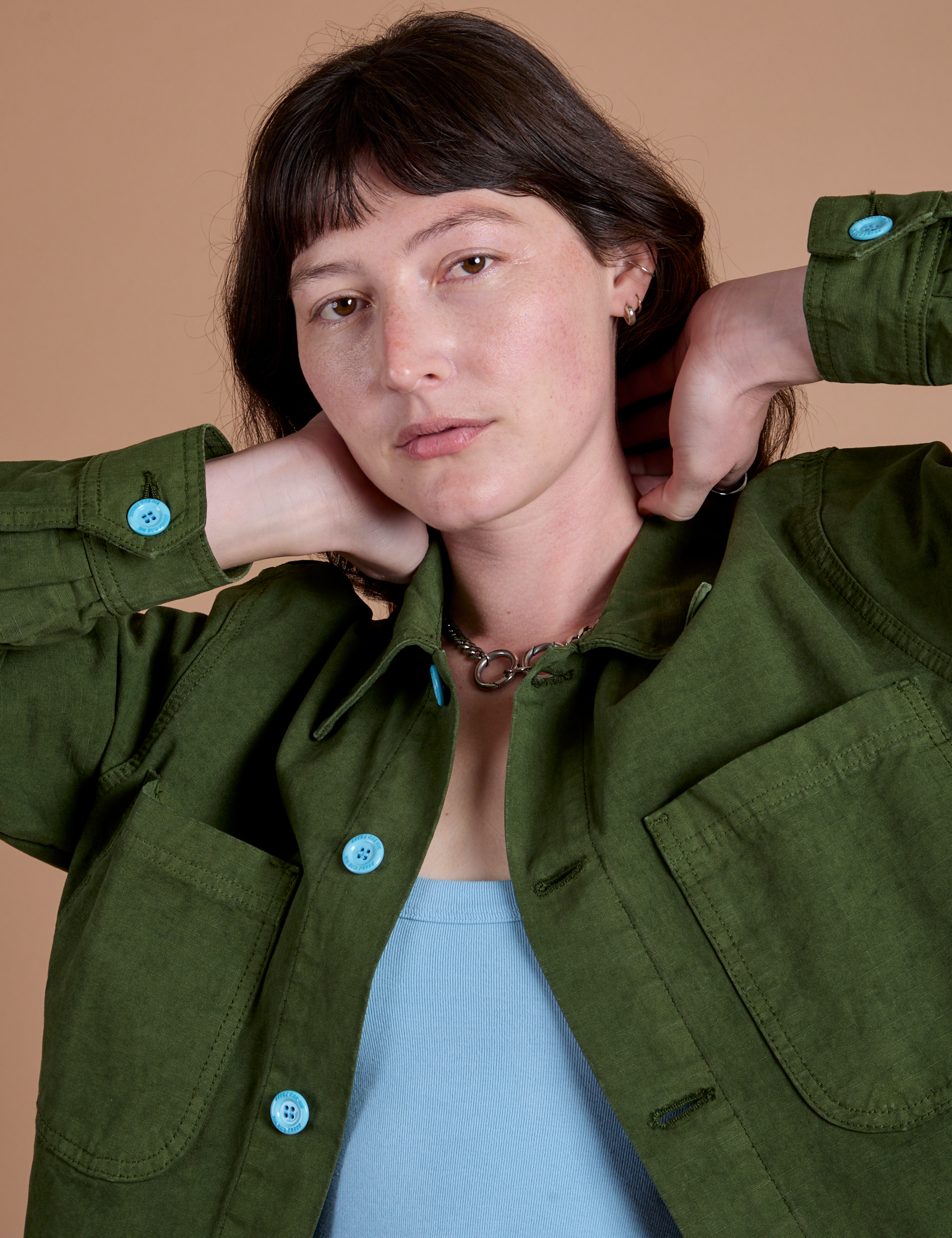 Ripstop Field Coat in Evergreen front close up on Alex