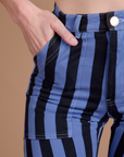 Close up of Alex's hand in the front pocket of Black Stripe Work Pants in Cornflower Blue