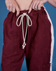 Painted Drop Pocket Cargo Pants in Red Wine front close up on Alex