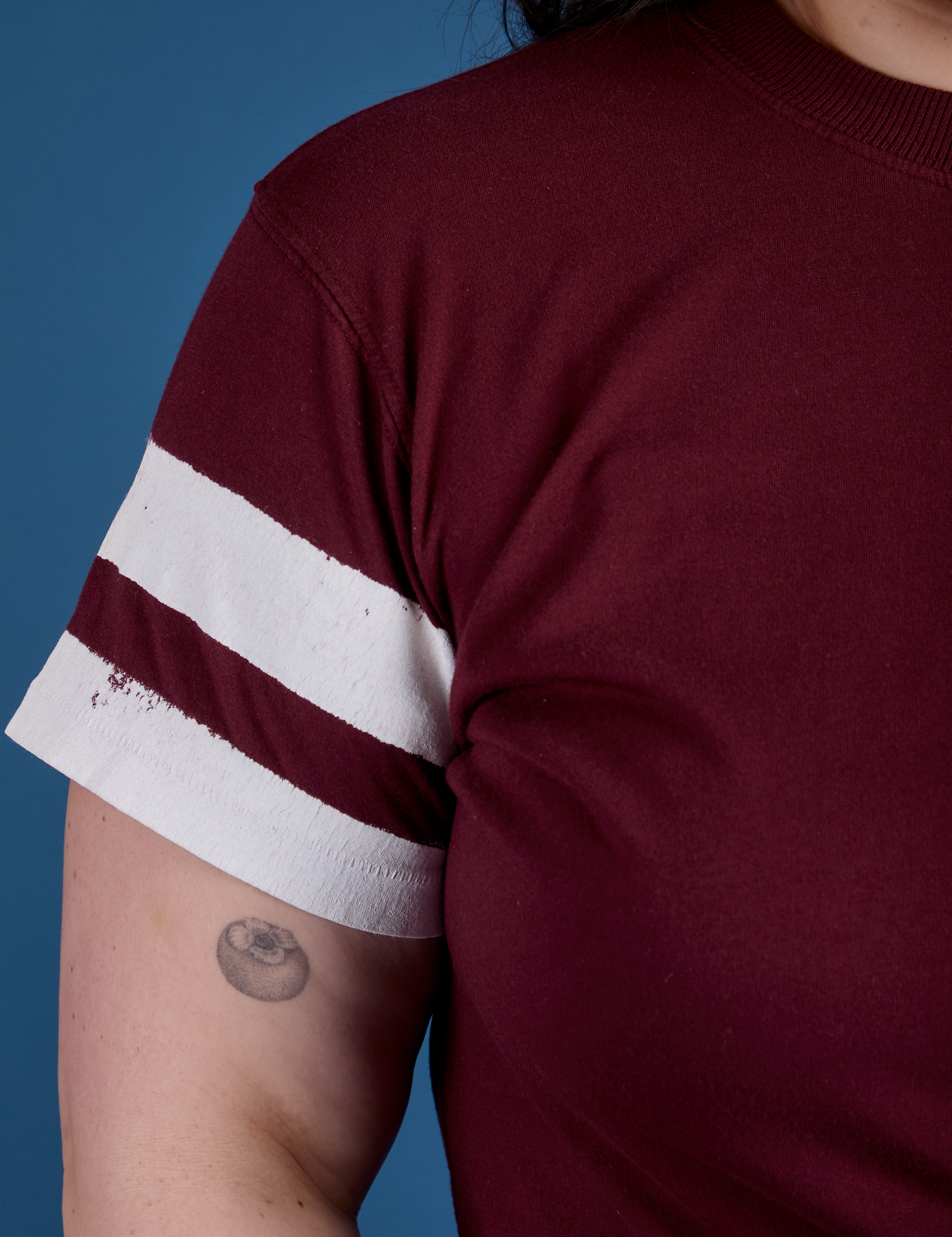 Painted Vintage Tee in Red Wine sleeve close up with two painted white stripes