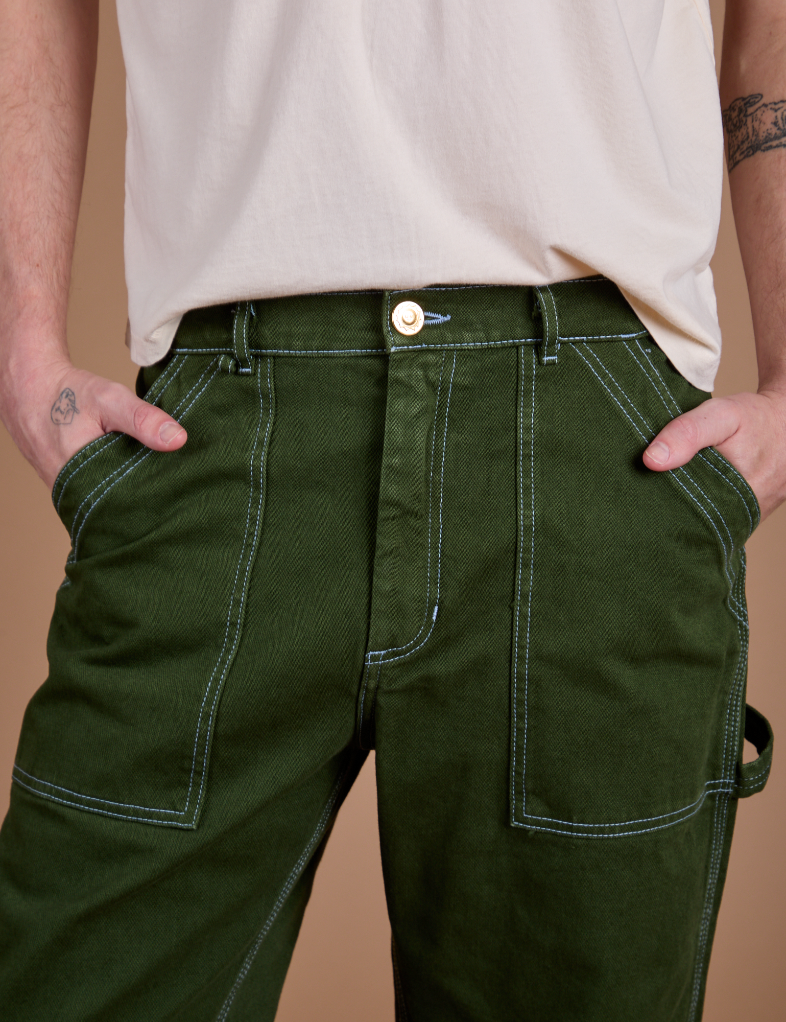 Front close up of Carpenter Jeans in Evergreen on Quinn