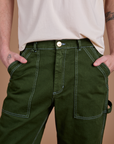 Front close up of Carpenter Jeans in Evergreen on Quinn