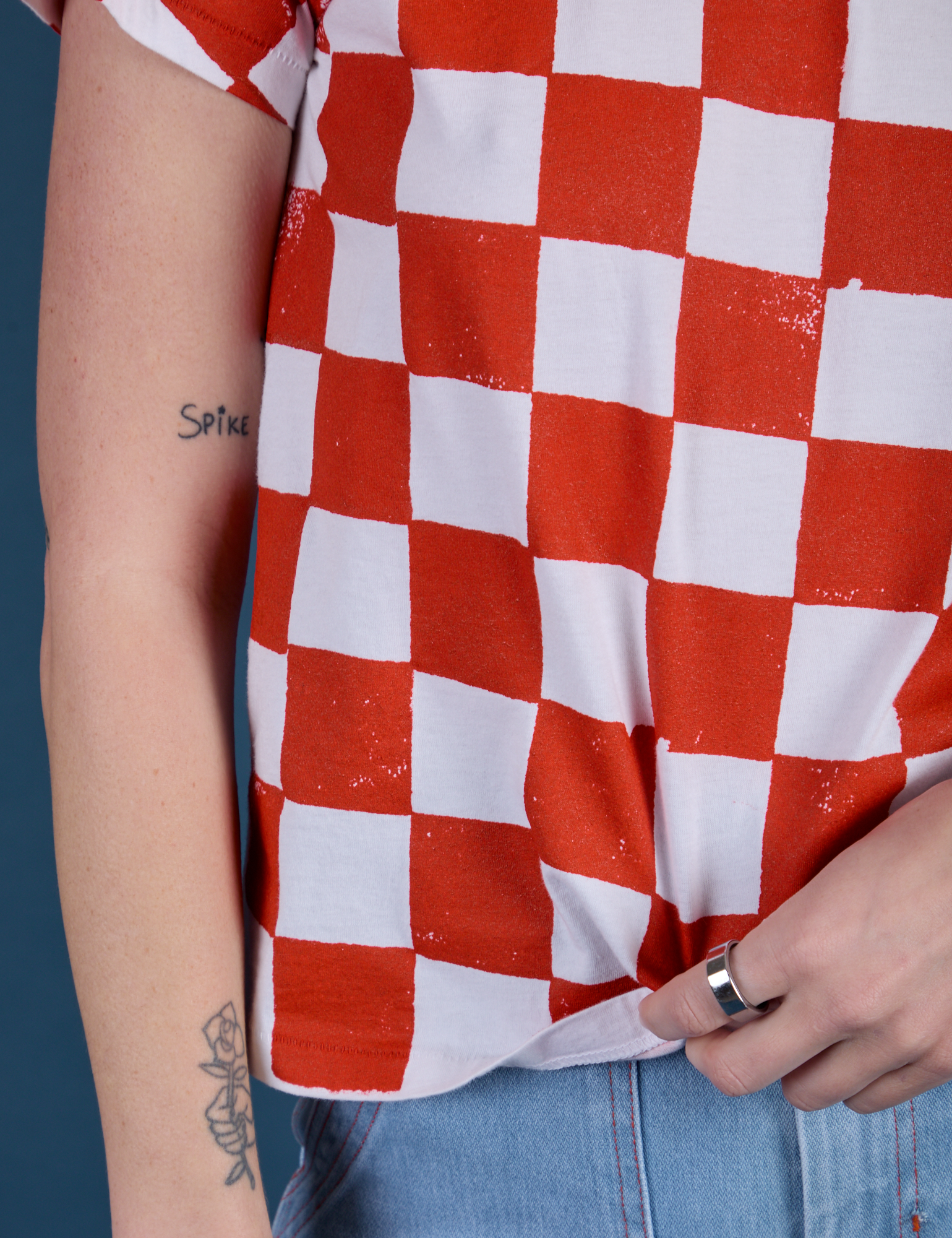 Checker Organic Tee in Red close up on Alex