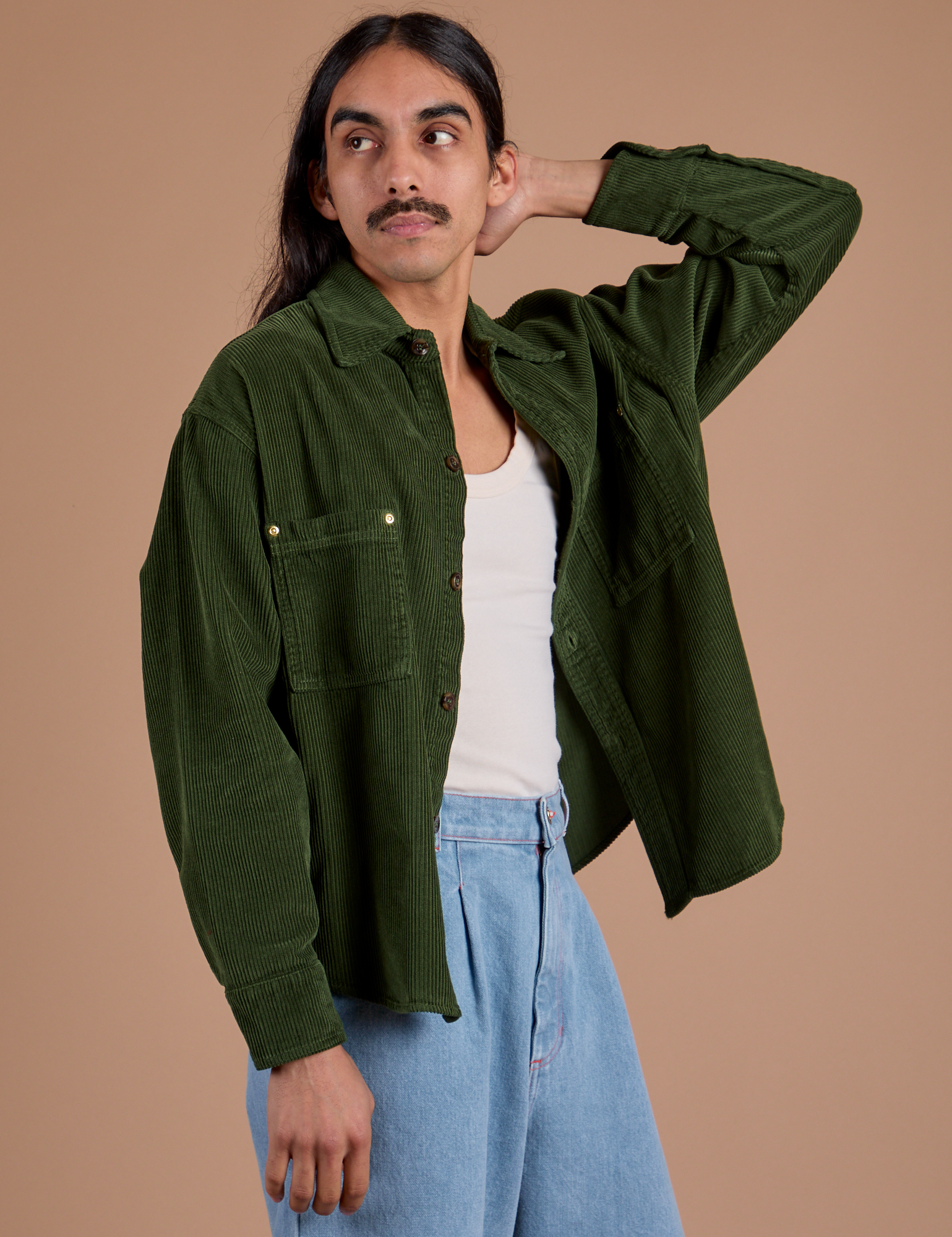 Angled front view of Cropped Corduroy Overshirt in Evergreen on Anthony