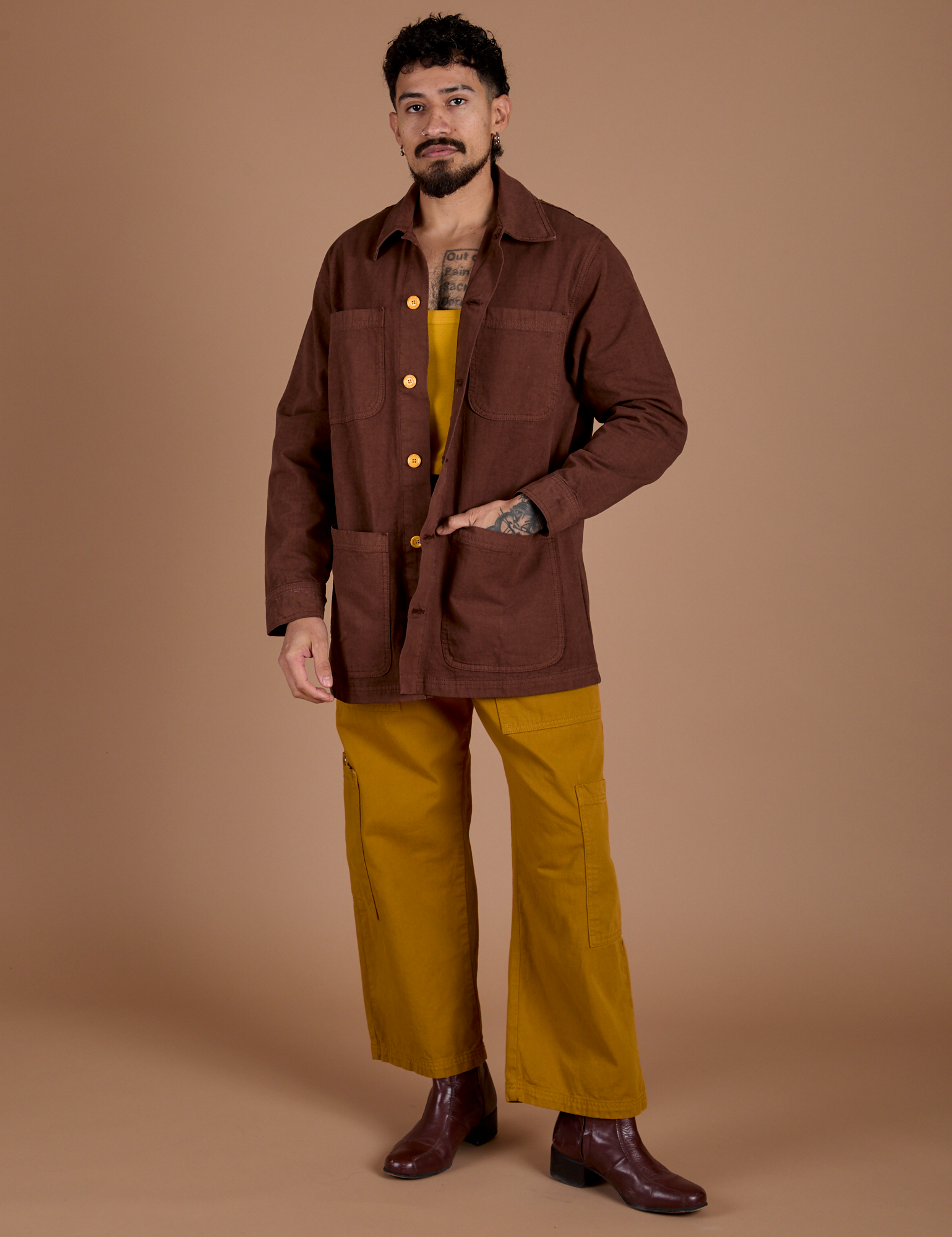 Jesse is wearing Ripstop Field Coat in Fudgesicle Brown and Spicy Mustard Drop Pocket Cargo Pants