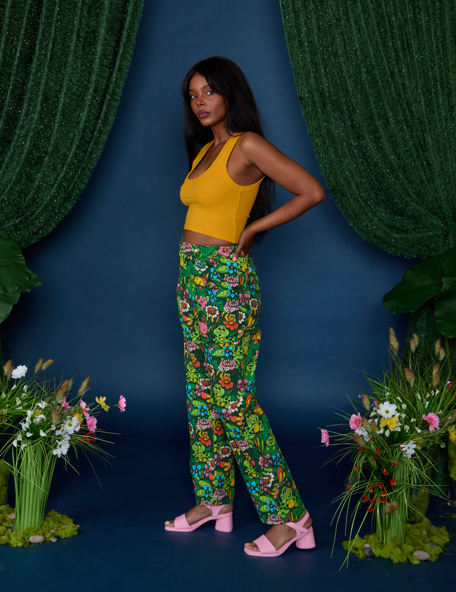 Side view of Work Pants in Pond Party and mustard yellow Cropped Tank on Kandia