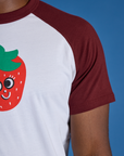 Close up of Produce Raglan Tee in Strawberry sleeve on Isaac