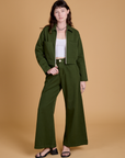 Alex is wearing Heritage Mechanic Jacket in Evergreen and matching Wide Leg Trousers