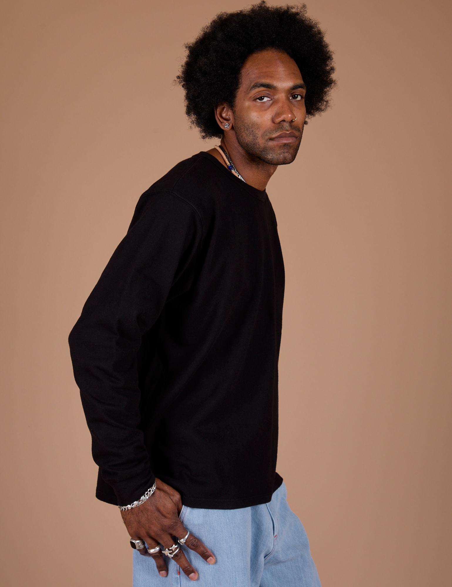 Long Sleeve Burly Tee in Basic Black side view on Jerrod