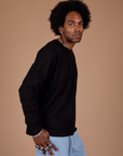 Long Sleeve Burly Tee in Basic Black side view on Jerrod